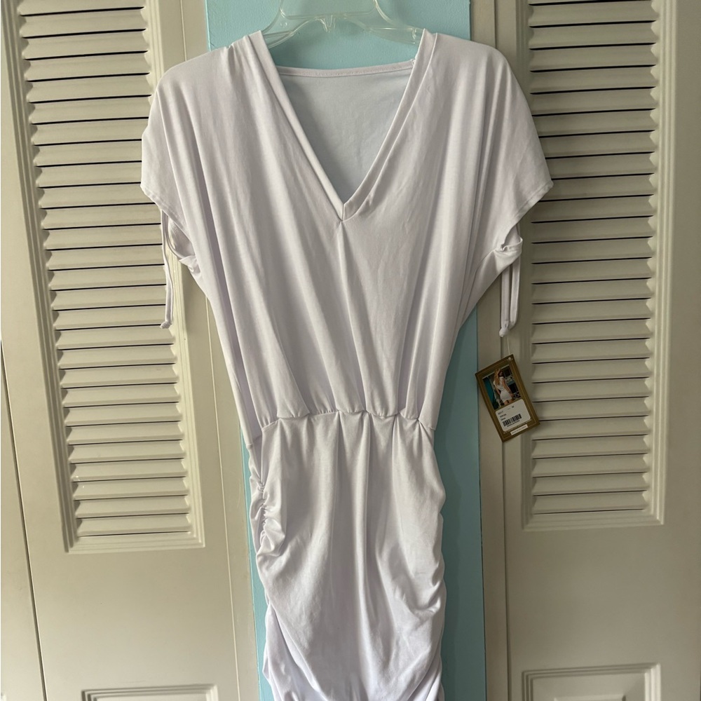 NWT flattering dress with ruching on side Gathers at back very figure flattering